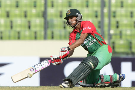 Bangladeshi cricketer Nasir Hossain plays a shot during the One Day International between India and Bangladesh at the Sher-e-Bangla National Cricket Stadium in Dhaka on June 15, 2014. (AFP)