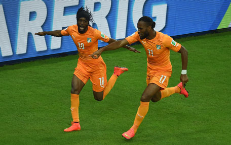 Ivory Coast's forward Gervinho (left) celebrates with Ivory Coast's forward and captain Didier Drogba after scoring during a Group C football match between Ivory Coast and Japan at the Pernambuco Arena in Recife during the 2014 FIFA World Cup on June 14, 2014. (AFP)