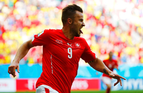Switzerland's Haris Seferovic celebrates after scoring a goal to defeat Ecuador in their 2014 World Cup Group E soccer match at the Brasilia national stadium in Brasilia, June 15, 2014. (REUTERS)