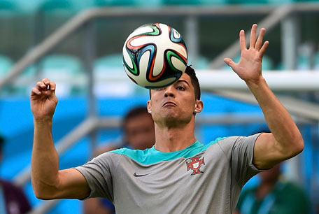 Portugal's Cristiano Ronaldo controls the ball during their 2014 World Cup team training session at the Fonte Nova arena in Salvador June 15, 2014. (REUTERS)