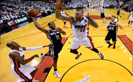 San Antonio Spurs forward Kawhi Leonard (2) goes to the basket as Miami Heat forward Chris Andersen (11) defends in the first half in Game 4 of the NBA basketball finals in Miami, Thursday, June 12, 2014. The Spurs won 107-86. (AP)
