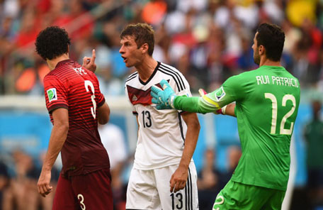 Thomas Mueller of Germany reacts after a headbutt by Pepe of Portugal as he is held back by Rui Patricio of Portugal during the 2014 FIFA World Cup Brazil Group G match between Germany and Portugal at Arena Fonte Nova on June 16, 2014 in Salvador, Brazil. (GETTY)