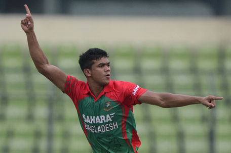 Bangladeshi bowler Taskin Ahmed reacts after the dismissal of Indian cricketer Cheteshwar Pujara during the second One Day International between India and Bangladesh at the Sher-e-Bangla National Cricket Stadium in Dhaka on June 17, 2014. (AFP)