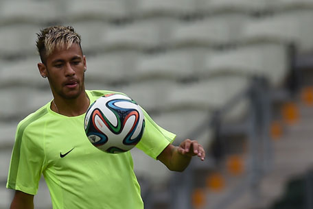 Brazil's forward Neymar eyes the ball during a training session at the Castelao Stadium in Fortaleza on June 16, 2014, on the eve of their Group E football match at the 2014 FIFA World Cup against Mexico. (AFP)