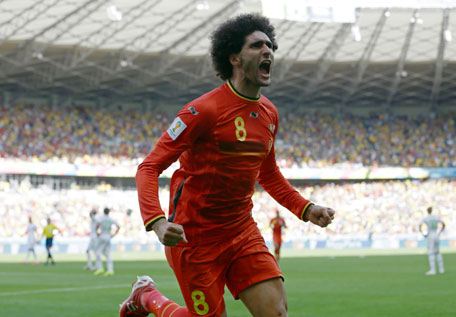 Belgium's Marouane Fellaini celebrates after scoring his side's first goal during the group H World Cup match between Belgium and Algeria at the Mineirao Stadium in Belo Horizonte, Brazil, Tuesday, June 17, 2014. (AP)