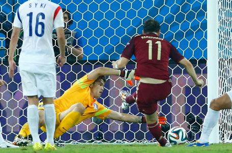 Russia's Alexander Kerzhakov (right) shoots to score past South Korea's Jung Sung-ryong during their 2014 World Cup Group H match at the Pantanal arena in Cuiaba June 17, 2014. (REUTERS)