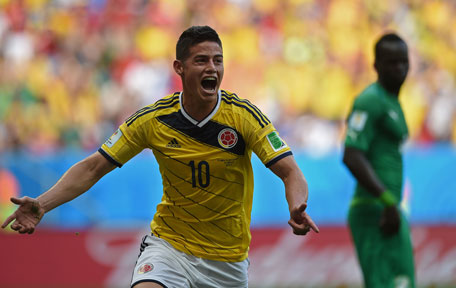 Colombia's midfielder James Rodriguez celebrates scoring during a Group C football match between Colombia and Ivory Coast at the Mane Garrincha National Stadium in Brasilia during the 2014 FIFA World Cup on June 19, 2014. (AFP)