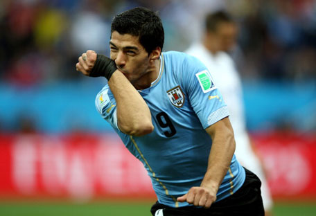 Luis Suarez of Uruguay celebrates scoring his team's first goal during the 2014 FIFA World Cup Brazil Group D match between Uruguay and England at Arena de Sao Paulo on June 19, 2014 in Sao Paulo, Brazil. (GETTY)