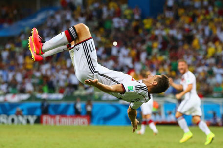 Miroslav Klose of Germany does a flip in celebration of scoring his team's second goal during the 2014 FIFA World Cup Brazil Group G match between Germany and Ghana at Castelao on June 21, 2014 in Fortaleza, Brazil. (GETTY)