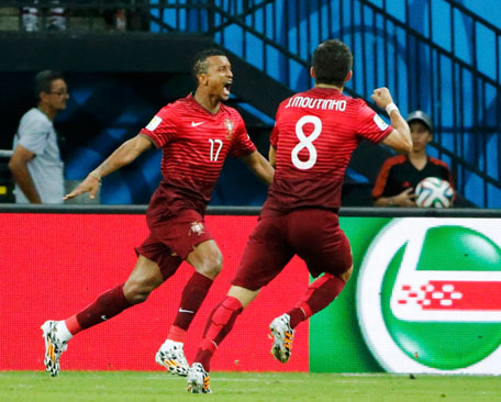 Portugal's Nani (left) celebrates after scoring a goal with teammate Joao Moutinho during their 2014 World Cup G match against the US at the Amazonia arena in Manaus June 22, 2014. (REUTERS)