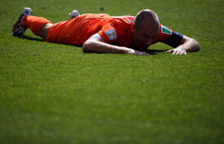 Arjen Robben of the Netherlands lies on the ground as he reacts to missing an opportunity to score a goal against Chile during their 2014 World Cup Group B soccer match at the Corinthians arena in Sao Paulo June 23, 2014. (REUTERS)