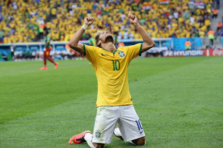 Neymar of Brazil celebrates scoring his team's second goal during the 2014 FIFA World Cup Brazil Group A match between Cameroon and Brazil at Estadio Nacional on June 23, 2014 in Brasilia, Brazil. (GETTY)