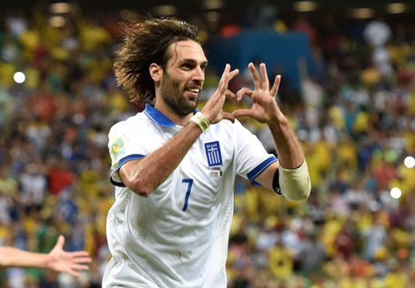 Greece's forward Georgios Samaras celebrates scoring a penalty during a Group C football match between Greece and Ivory Coast at the Castelao Stadium in Fortaleza during the 2014 FIFA World Cup on June 24, 2014. (AFP)