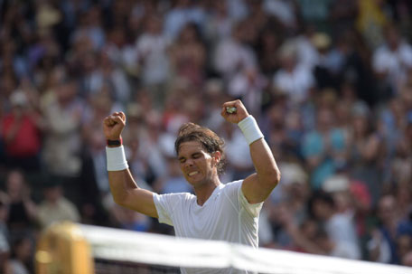 Spain's Rafael Nadal celebrates beating Slovakia's Martin Klizan during their men's singles first round match on day two of the 2014 Wimbledon Championships at The All England Tennis Club in Wimbledon, southwest London, on June 24, 2014. (AFP)