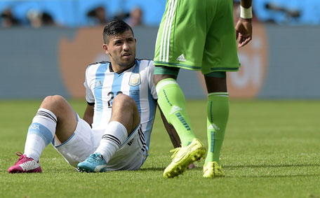 Argentina's forward Sergio Aguero reacts after falling and before being substituted for an injury during the Group F football match between Nigeria and Argentina at the Beira-Rio Stadium in Porto Alegre during the 2014 FIFA World Cup on June 25, 2014. (AFP)