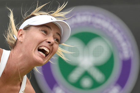Maria Sharapova of Russia reacts against Timea Bacsinszky of Switzerland during their women's singles tennis match on No.1 Court at the Wimbledon Tennis Championships in London June 26, 2014. (REUTERS)