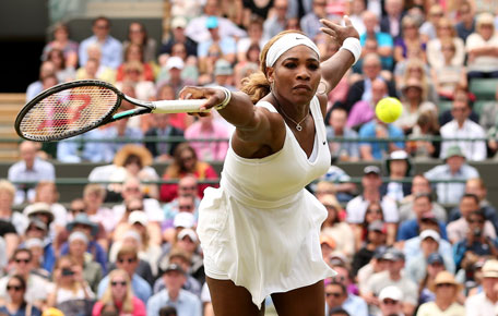 Serena Williams returns to Chanelle Scheepers during their women's singles second round match on day four of the 2014 Wimbledon Championships at The All England Tennis Club in Wimbledon, southwest London, on June 26, 2014. (AFP)