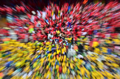 Brazil and Chile fans cheer prior to the Round of 16 football match between Brazil and Chile at The Mineirao Stadium in Belo Horizonte during the 2014 FIFA World Cup on June 28, 2014. (AFP)