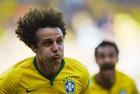 Brazil's defender David Luiz celebrates after scoring a goal during the round of 16 match between Brazil and Chile at The Mineirao Stadium in Belo Horizonte during the 2014 FIFA World Cup on June 28, 2014. (AFP)
