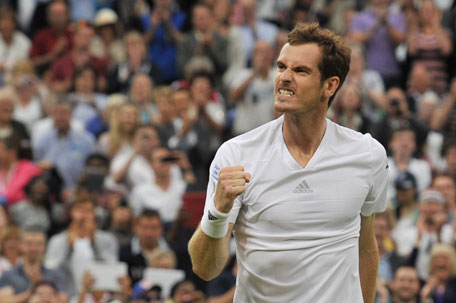 Britain's Andy Murray celebrates winning his men's singles fourth round match against South Africa's Kevin Anderson on day seven of the 2014 Wimbledon Championships at The All England Tennis Club in Wimbledon, southwest London, on June 30, 2014. (AFP)