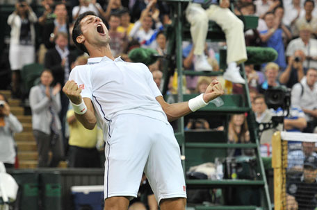 Serbia's Novak Djokovic celebrates winning his men's singles fourth round match against France's Jo-Wilfried Tsonga on day seven of the 2014 Wimbledon Championships at The All England Tennis Club in Wimbledon, southwest London, on June 30, 2014. (AFP)