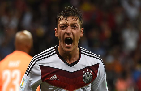 Germany's midfielder Mesut Ozil celebrates scoring during a Round of 16 match between Germany and Algeria at Beira-Rio Stadium in Porto Alegre during the 2014 FIFA World Cup on June 30, 2014. (AFP)