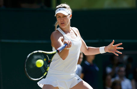 Eugenie Bouchard of Canada hits a return during her women's singles semi-final against Simona Halep of Romania at the Wimbledon Tennis Championships, in London July 3, 2014. (REUTERS)