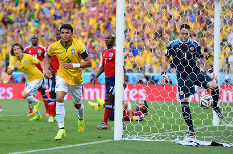 Thiago Silva of Brazil celebrates after scoring his team's first goal past David Ospina of Colombia during the 2014 FIFA World Cup Brazil Quarter Final match between Brazil and Colombia at Castelao on July 4, 2014 in Fortaleza, Brazil. (GETTY)