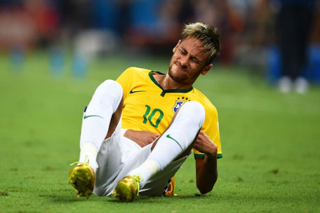 Neymar of Brazil reacts after a challenge during the 2014 FIFA World Cup Brazil Quarter Final match between Brazil and Colombia at Castelao on July 4, 2014 in Fortaleza, Brazil. (GETTY)