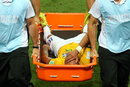 Neymar of Brazil is taken off the pitch by a stretcher during the 2014 FIFA World Cup Brazil Quarter Final match between Brazil and Colombia at Estadio Castelao on July 4, 2014 in Fortaleza, Brazil. (GETTY)