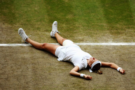 Petra Kvitova of Czech Republic celebrates championship point during the Ladies' Singles final match against Eugenie Bouchard of Canada on day twelve of the Wimbledon Lawn Tennis Championships at the All England Lawn Tennis and Croquet Club on July 5, 2014 in London, England. (GETTY)