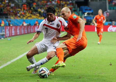 Christian Bolanos of Costa Rica challenges Arjen Robben of the Netherlands during the 2014 FIFA World Cup Brazil Quarter Final match between the Netherlands and Costa Rica at Arena Fonte Nova on July 5, 2014 in Salvador, Brazil. (GETTY)