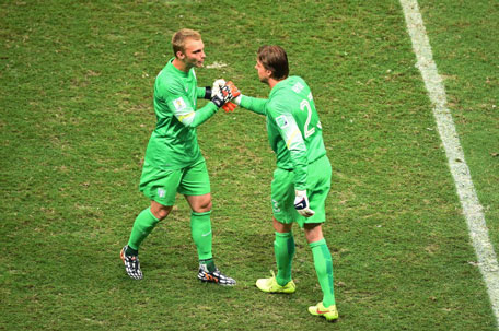 Tim Krul of the Netherlands shakes hands with Jasper Cillessen as he enters the game during the 2014 FIFA World Cup Brazil Quarter Final match between the Netherlands and Costa Rica at Arena Fonte Nova on July 5, 2014 in Salvador, Brazil. (GETTY)