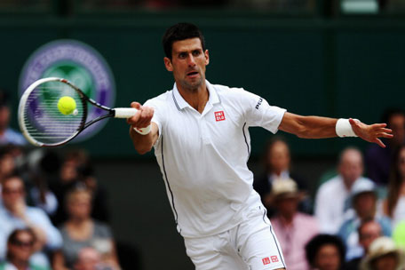 Novak Djokovic of Serbia plays a forehand return during the Gentlemen's Singles Final match against Roger Federer of Switzerland on day thirteen of the Wimbledon Lawn Tennis Championships at the All England Lawn Tennis and Croquet Club on July 6, 2014 in London, England. (GETTY)