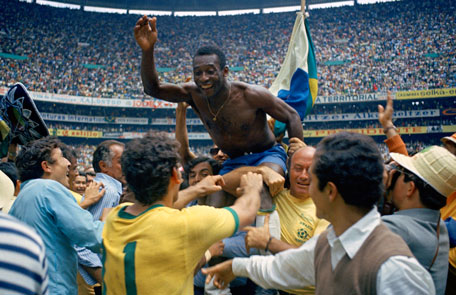 In this June 21, 1970 file photo, Brazil's Pele is hoisted on shoulders of his teammates after Brazil won the World Cup final against Italy, 4-1, in Mexico City's Estadio Azteca.  (AP)