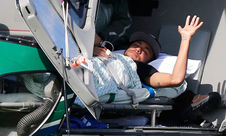 Injured Brazilian national soccer team player Neymar waits to be airlifted home from Brazil's training camp inTeresopolis, near Rio de Janeiro, July 5, 2014. (REUTERS)