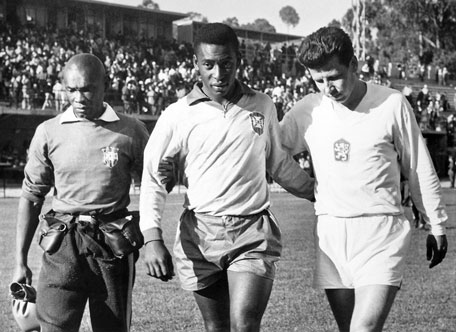 In this Feb. 1962, file photo, shows Edson Arantes do Nascimento known as Pele (centre), trainer Mario Americo (left) and Czech player Masopust. (AP)