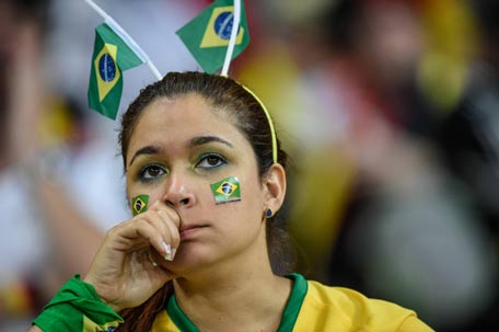 A fan of Brazil gestures during the Brazil 2014 FIFA World Cup. (AFP)