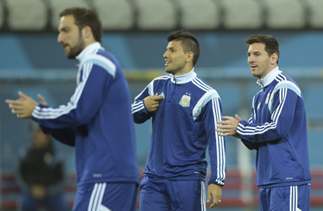 Argentina's forwards Lionel Messi (right), Sergio Aguero (centre) and Gonzalo Higuain take part in a training session at the Arena de Sao Paulo Stadium, on July 08, on the eve of the 2014 FIFA World Cup semi-final against Netherlands. (AFP)