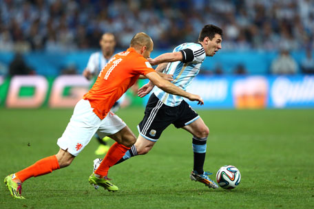 Arjen Robben of the Netherlands challenges Lionel Messi of Argentina during the 2014 FIFA World Cup Brazil Semi Final match between the Netherlands and Argentina at Arena de Sao Paulo on July 9, 2014 in Sao Paulo, Brazil. (GETTY)