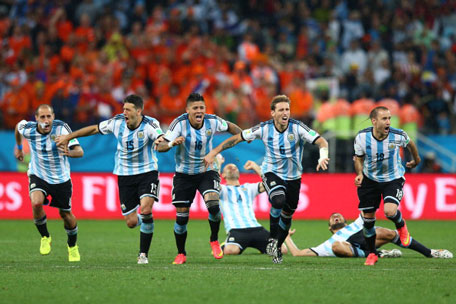 Argentina players celebrate after defeating the Netherlands in a penaty shootout during the 2014 FIFA World Cup Brazil Semi Final at Arena de Sao Paulo on July 9, 2014 in Sao Paulo, Brazil. (GETTY)