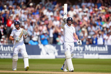 England batsman Joe Root (left) applauds James Anderson after Anderson had reached his half century during day four of the 1st Investec Test Match between England and India at Trent Bridge on July 12, 2014 in Nottingham, England. (GETTY)