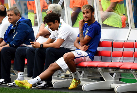 An injured Neymar of Brazil looks on from the bench prior to the 2014 FIFA World Cup Brazil Third Place Playoff match between Brazil and the Netherlands at Estadio Nacional on July 12, 2014 in Brasilia, Brazil. (GETTY))