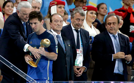 Argentina's Lionel Messi walks away after receiving the Golden Ball trophy following Germany's 1-0 victory over Argentina after the World Cup final soccer match between Germany and Argentina at the Maracana Stadium in Rio de Janeiro, Brazil, Sunday, July 13, 2014.  (AP)