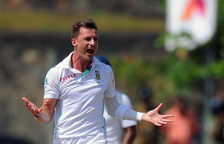 South African bowler Dale Steyn celebrates after dismissing Sri Lankan batsman Kaushal Silva during the final day of the opening Test between Sri Lanka and South Africa at the Galle International Cricket Stadium in Galle on July 20, 2014. (AFP)
