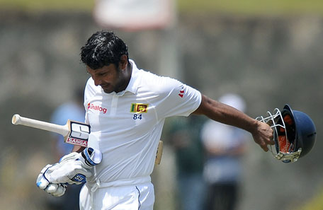 Sri Lankan batsman Kumar Sangakkara reacts after his dismissal during the third day of the opening Test between Sri Lanka and South Africa at the Galle International Cricket Stadium in Galle on July 18, 2014. (AFP)