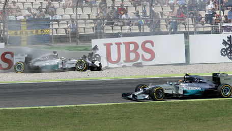 Mercedes driver Lewis Hamilton of Britain has crashed as Mercedes driver Nico Rosberg of Germany drives by during the qualifying of the German Formula One Grand Prix in Hockenheim, Germany, Saturday, July 19, 2014. (AP)