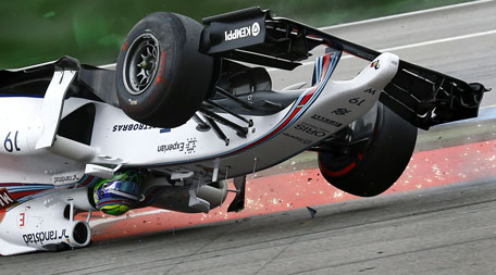 Williams Formula One driver Felipe Massa of Brazil crashes with his car in the first corner after the start of the German F1 Grand Prix at the Hockenheim racing circuit, July 20, 2014.    (REUTERS)