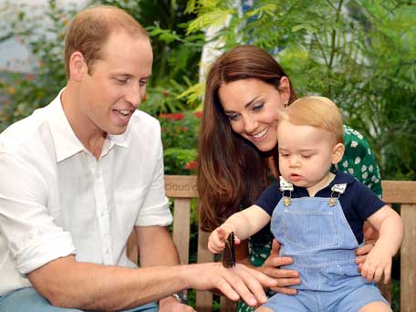 A photograph taken in London on Wednesday July 2, 2014, to mark Britain's Prince George's first birthday, shows Prince William (R) and Catherine, Duchess of Cambridge (L) with Prince George during a visit to the Sensational Butterflies exhibition at the Natural History Museum in London. Britain's Prince William and his wife Catherine on Monday thanked well-wishers around the world as they prepared to celebrate their son Prince George's first birthday. (AFP)