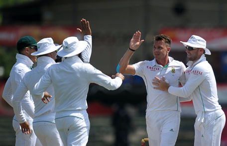 South African cricketer Dale Steyn (second right) celebrates with teammates after he dismissed Sri Lankan batsman Upul Tharanga during the opening day of the second Test at the Sinhalease Sports Club Ground in Colombo on July 24, 2014. (AFP)
